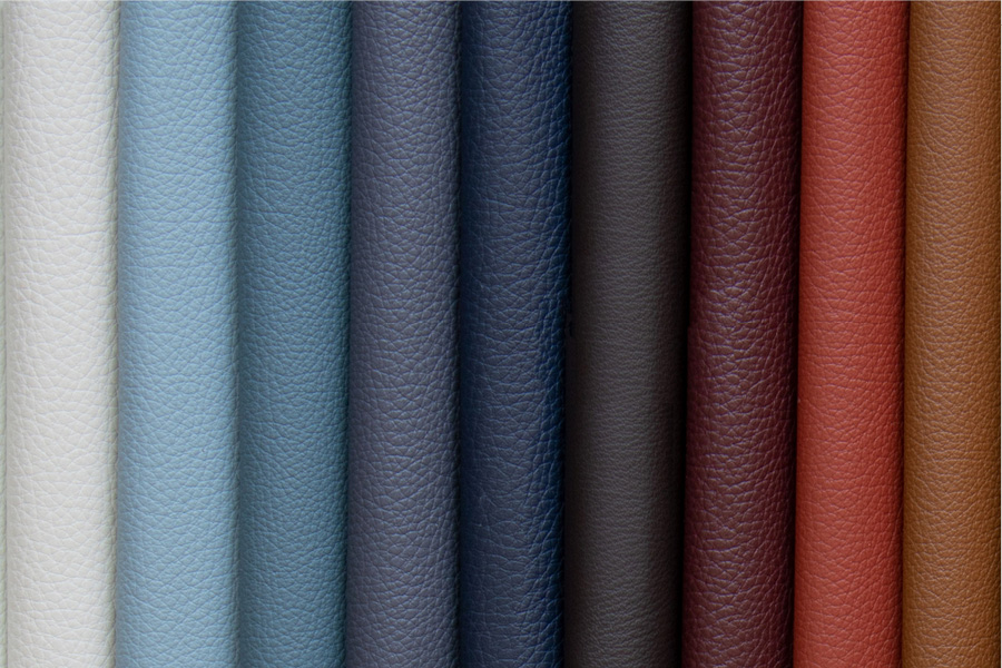 A row of textured leather swatches arranged vertically in gradient colors from light cream to brown.