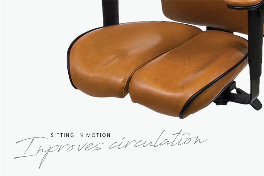 Ergonomic office chair with split seat (CoreFlex) tan leather seat designed to improve circulation and promote active sitting with black frame