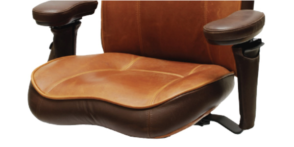 Close-up of a two-tone leather office chair with Large Contour Seat with padded armrests.
