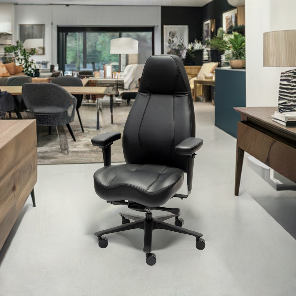 LIFEFORM Legacy 900 Executive High Back Chair A black leather high-back ergonomic office chair with a contoured seat is featured in a modern, open-plan home office and living space.