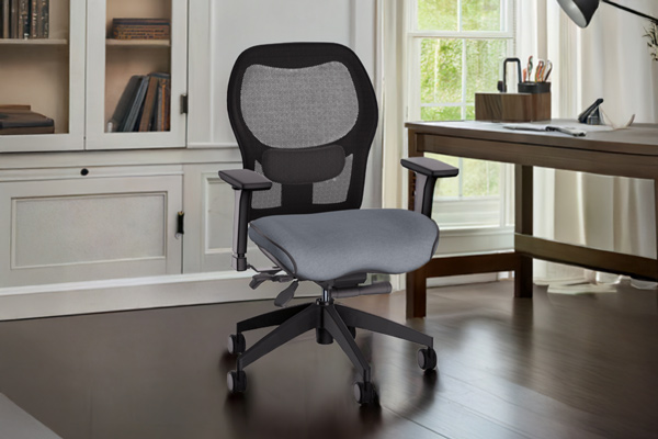Mid-back ergonomic office chair featuring a grey upholstered seat cushion, black mesh backrest, adjustable armrests, and five-wheel caster base. The chair is positioned on dark hardwood flooring in a well-lit home office with white built-in cabinetry, glass-front bookcases, a wooden desk, and natural light from windows.